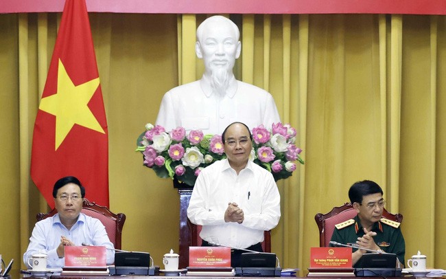Chủ tịch nước Nguyễn Xuân Phúc, Trưởng ban Chỉ đạo xây dựng Đề án dự và chỉ đạo phiên họp (Ảnh: TTXVN)